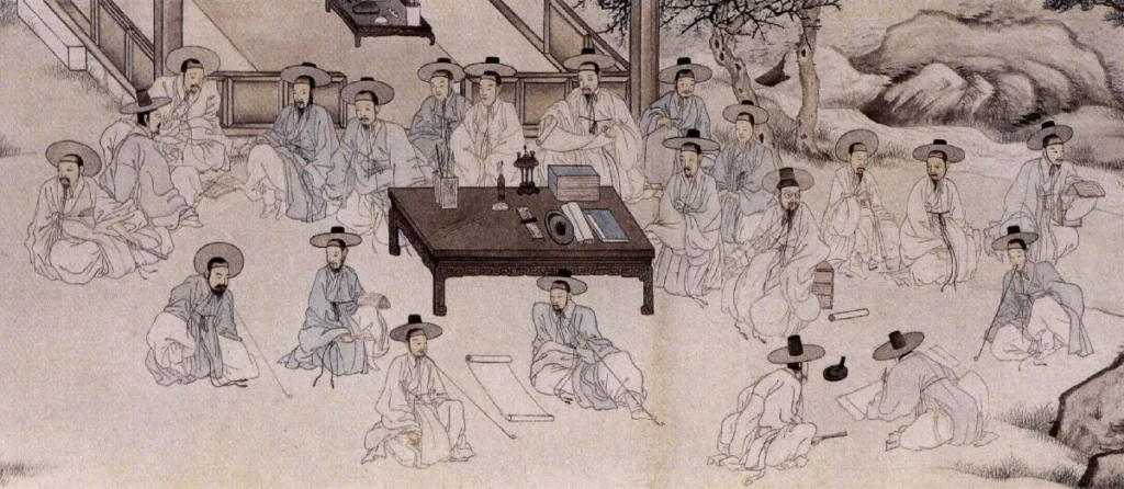 A close-up detail from Yu Suk's 1853 scroll painting, Sugyedogwon (Literati Gathering for a Purification Ceremony). The scene captures a group of Chosun-dynasty scholarly figures (literati) gathered around a large wooden table piled with books and writing tools. The attire of the twenty-plus figures is the key element: nearly all wear traditional white Hanbok robes, though closer inspection reveals these whites are not pure, but varied natural tones of pale ivory and bone. A small number of figures wear delicate, pale-blue robes, adding soft contrast. All are shown in contemplative poses, wearing black hats (gat) as they interact with each other and open scroll documents, with stylized pine trees and rock formations in the background.